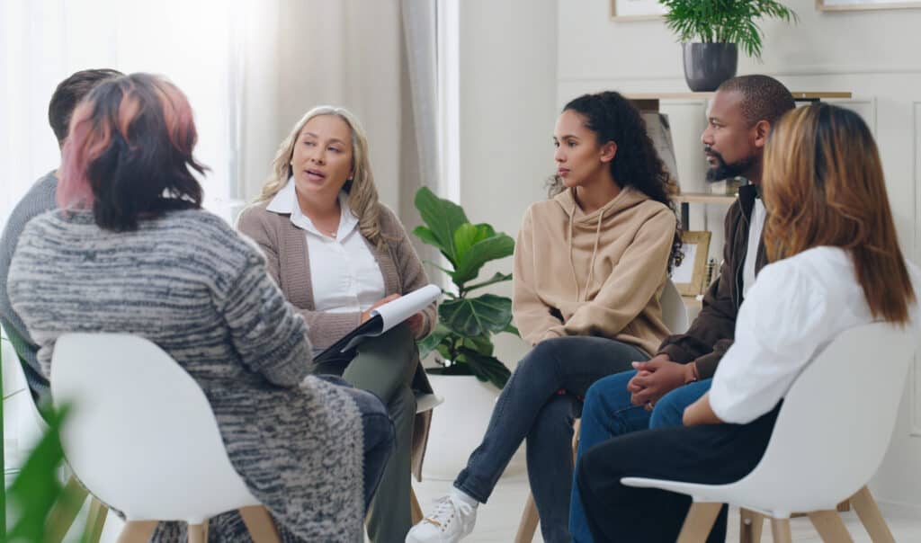 Counseling, group and psychology discussion with group of diversity people in therapy for depressio