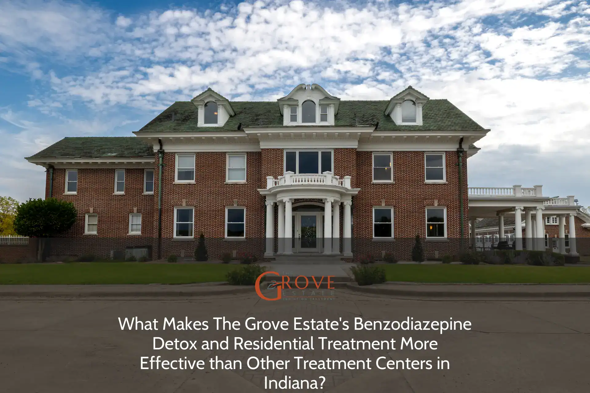 Historic brick estate featuring elegant columns at the entrance, surrounded by manicured lawns, serving as the Grove Estate's Benzodiazepine Detox center in Indiana.