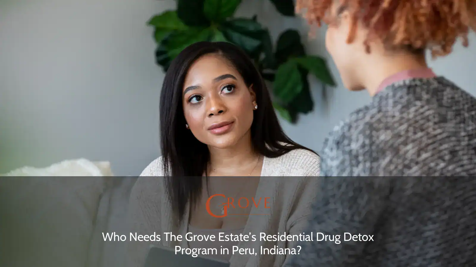 Two women engage in a conversation, discussing the Grove Estate’s Residential Drug Detox Program in Peru, Indiana, while seated in a cozy setting.