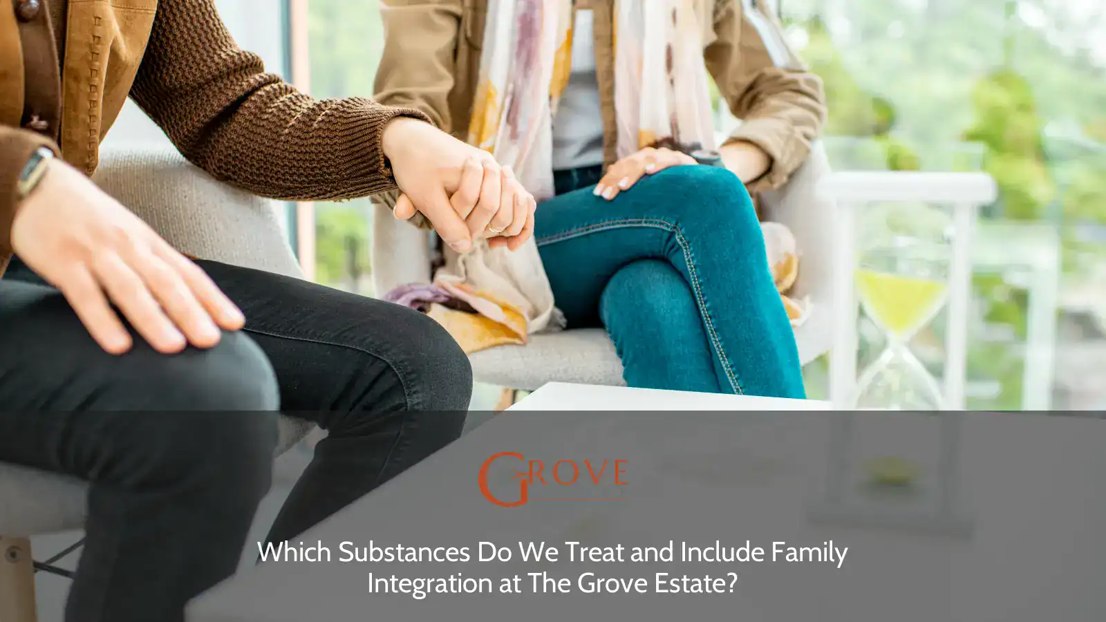 Couple holding hands during a therapy session, with tissues and an hourglass on the table, reflecting emotional support and family integration at The Grove Estate.