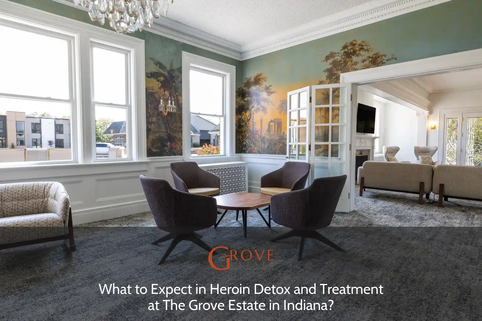 Inviting lounge area at The Grove Estate in Indiana, featuring a stylish mural, modern seating, and natural light streaming through large windows.