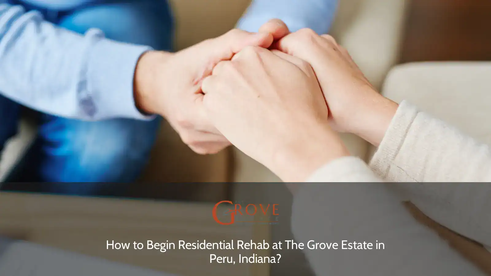 Hands clasped together in a supportive gesture, emphasizing connection and understanding during a counseling session at The Grove Estate, Peru, Indiana.